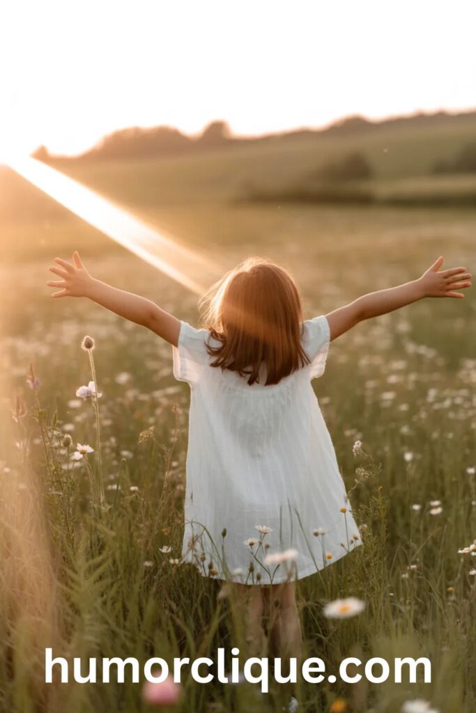 Young girl with arms outstretched in sunlit meadow representing living out the biblical meaning of Evelyn as life and light